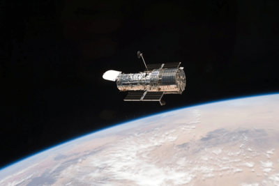 A Figure-Eight in Deep Space: Hubble Image Shows Gravity Warping Distant Galaxies